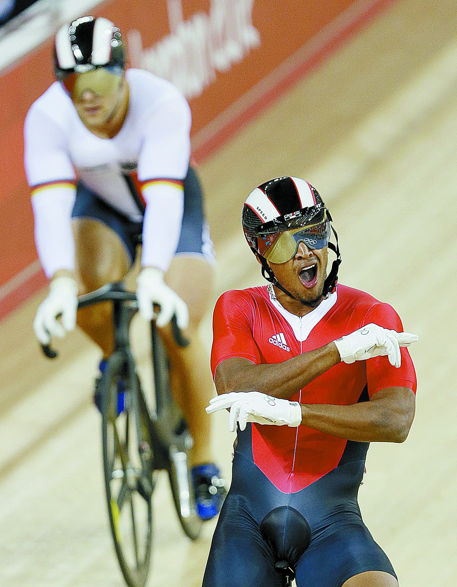 Njisane Phillip celebrates after defeating Germany’s Robert Forstemann during a men’s sprint event at the 2012 Olympics in London.